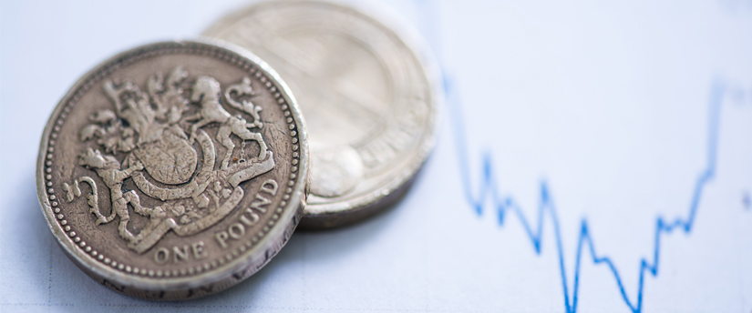 Two pounds with a diagram in the background, symbolizing the implications of Brexit on the currency.