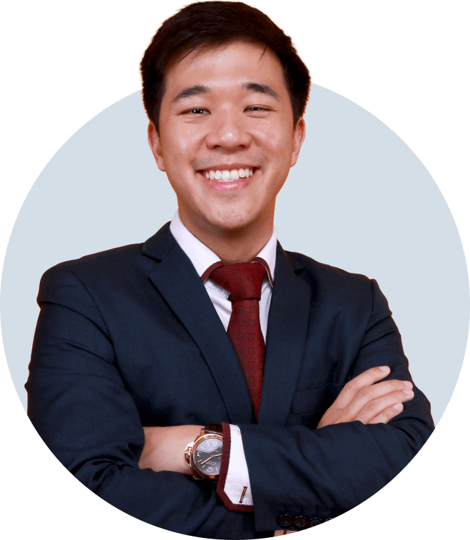 Chief Trader at Everest Fortune Group Desmond Leong smiling in a dark blue suit and red tie