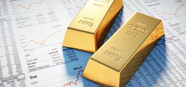 two gold bars on a piece of paper with some numbers referring to online metal trading