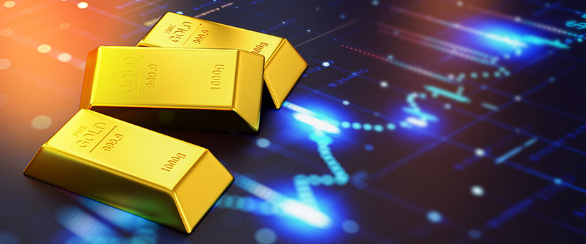 3 gold bars on top of a screen showing a technical chart referring to trading gold forex