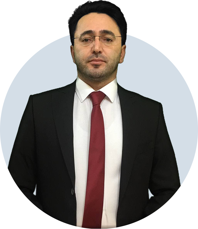Ahura Chalki Financial Analyst in a dark blue suit and red tie