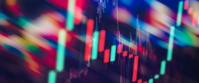 a colourful screen showing green and red candlesticks which is related to forex trading insights.