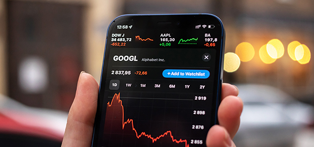 Empower your financial journey: a user holding a mobile, featuring Google's stock data display. Stay connected to market insights on the go.