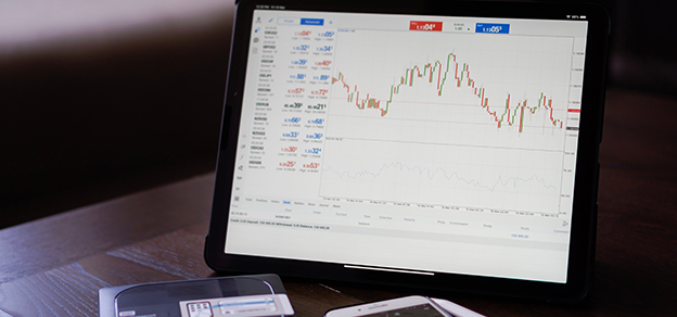 A high-resolution device with a vivid display showcasing dynamic real-time MetaTrader 4 trading data, charts, and financial statistics.