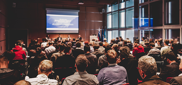 Crowds of traders engaged in Forex seminars, sharing insights and strategies for successful currency trading.