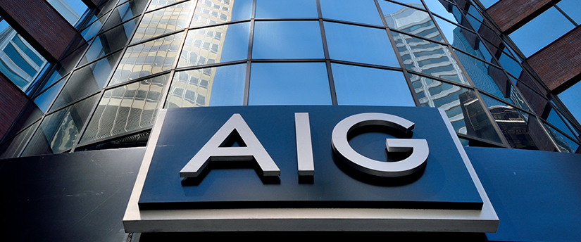 The AIG sign on a building, representing the presence of the American International Group in the financial industry.