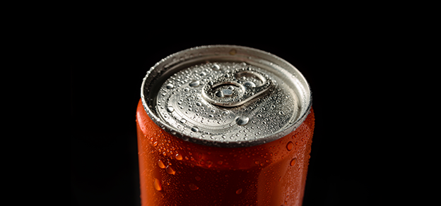 An aluminum lid from a Coca-Cola container, showcasing the iconic beverage brand and its packaging.