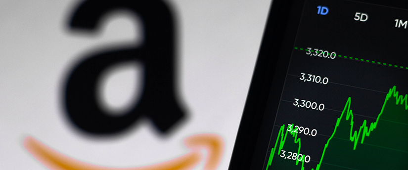 A mobile displaying a financial chart with the Amazon logo in the background, representing Amazon's presence in the stock market.