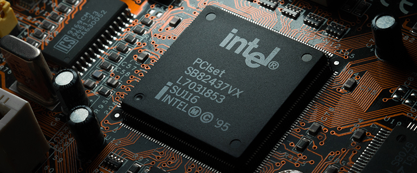 A microchip bearing the Intel logo, illustrating technology and semiconductor innovations by Intel.