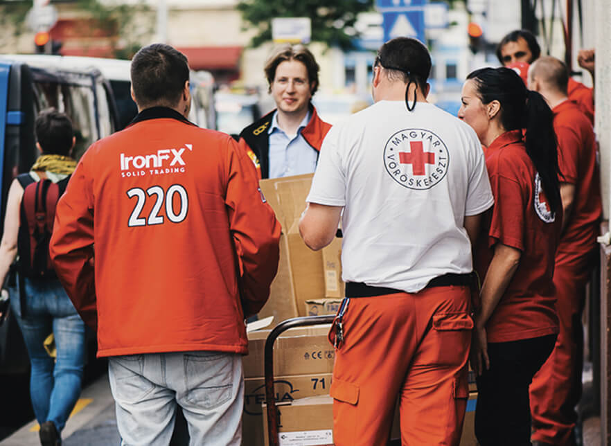 Red Cross and IronFx volunteers providing assistance and support to those in need.