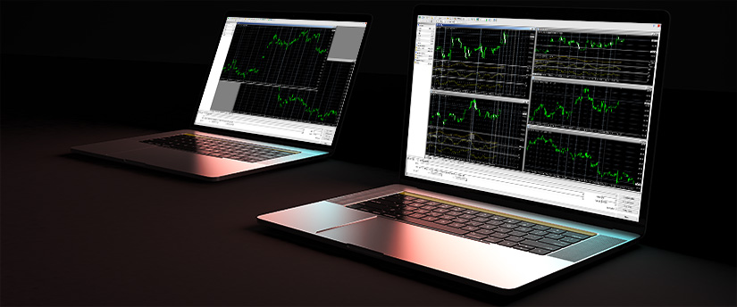 Two laptops side by side, both running MetaTrader 4, creating a dual-screen trading environment for in-depth financial analysis.