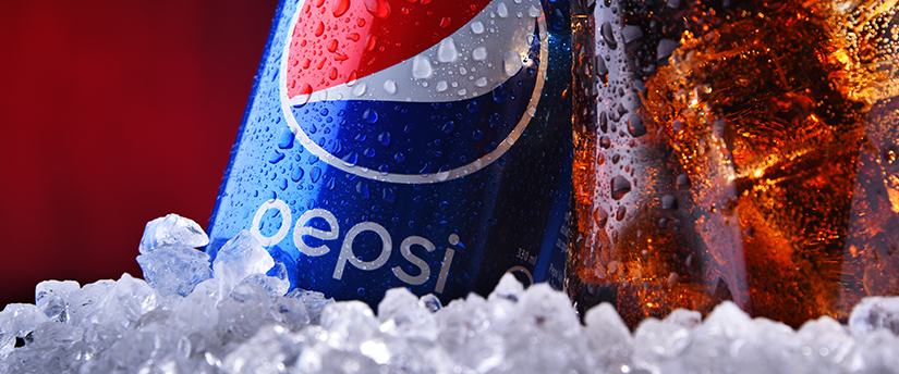 A bottle and a glass of Pepsi with ice, illustrating the refreshing and beverage aspect of the brand.