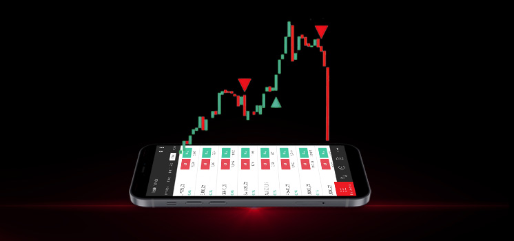 A mobile phone displaying MetaTrader 4 data, with a live chart above it, provides traders with essential tools for informed decision-making.