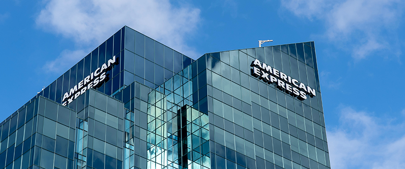 The American Express logo displayed on a building, signifying the presence and identity of the financial services company.