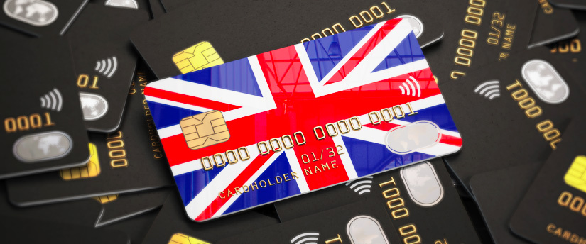 Amidst a sea of plastic, a pile of credit cards awaited their moment of financial conquest, with one proudly donning the flag of England, standing out as a symbol of British spending power.