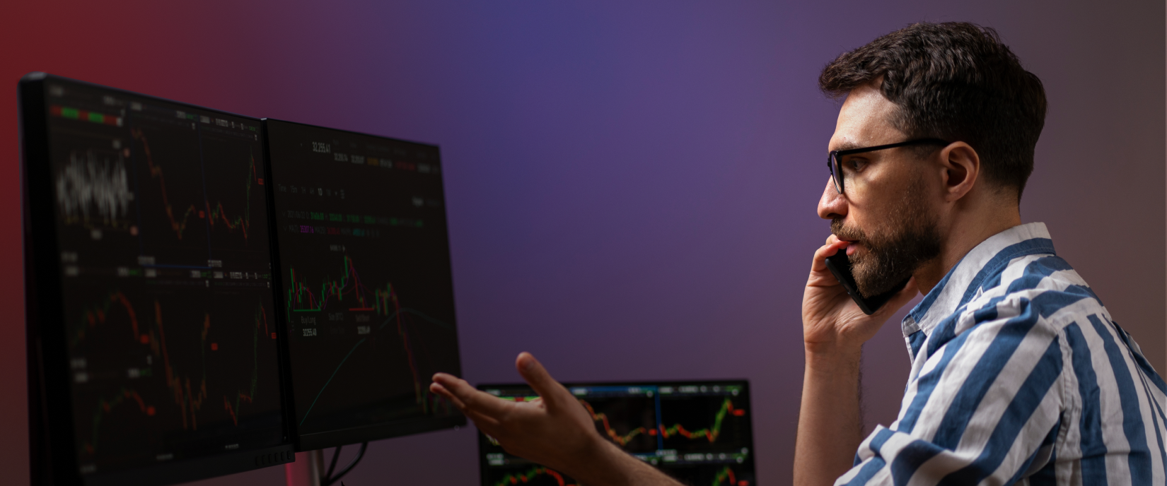 A trader intently studying forex data on multiple screens, deep in thought about the market.