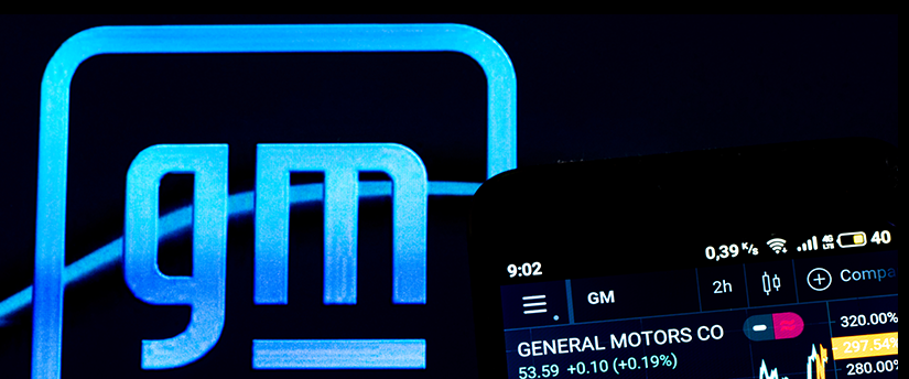 A mobile showing live forex data, revealing fluctuations, with the distinctive GM logo displayed behind, symbolizing dynamic financial insights.
