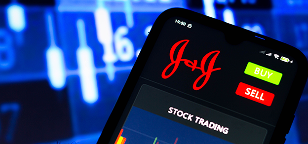 The Johnson & Johnson logo on a mobile device displaying stock trading data, bridging healthcare and finance.