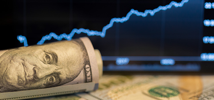 A dollar symbol stands strong with a rising diagram in the background, a representation of financial growth and prosperity.