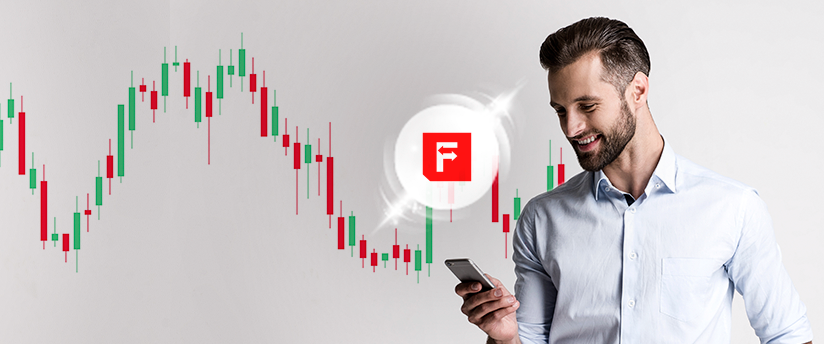 A trader looking upwards with stock markets behind him, alongside the IronFX icon, showcasing his engagement with the platform.