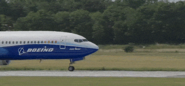 An airplane taking off with the Boeing logo, exemplifying the aviation industry's reliance on Boeing's products.