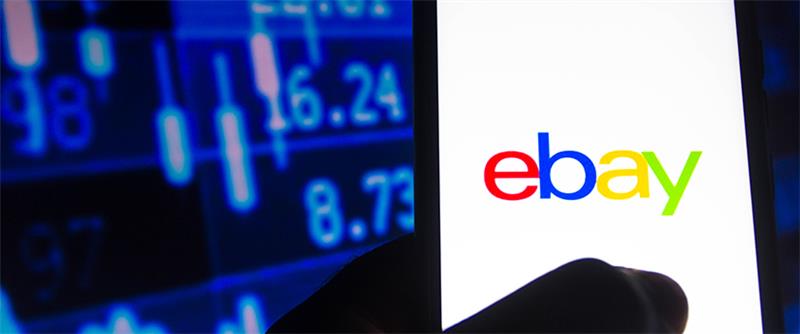 A user holding a mobile with the eBay logo, accompanied by candlestick charts, blending e-commerce with financial analysis.
