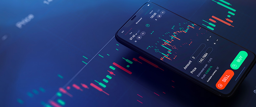A mobile device and a tablet displaying candlestick charts, exemplifying the versatility of a trading platform.