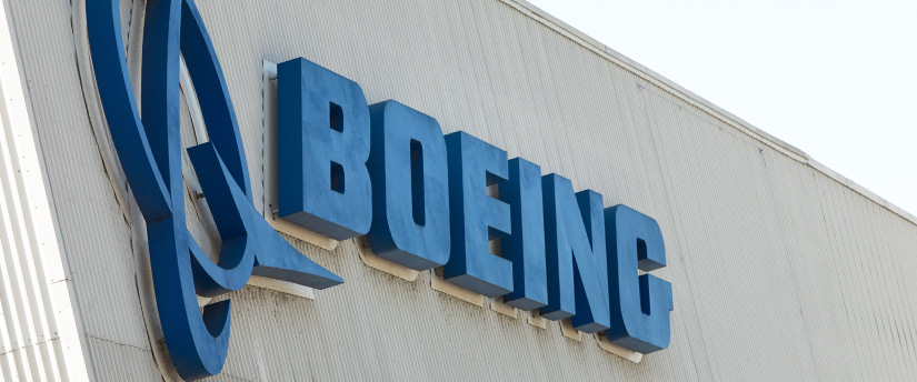 The prominent Boeing label adorns the towering edifice, symbolizing its enduring presence in the world of aviation and innovation.