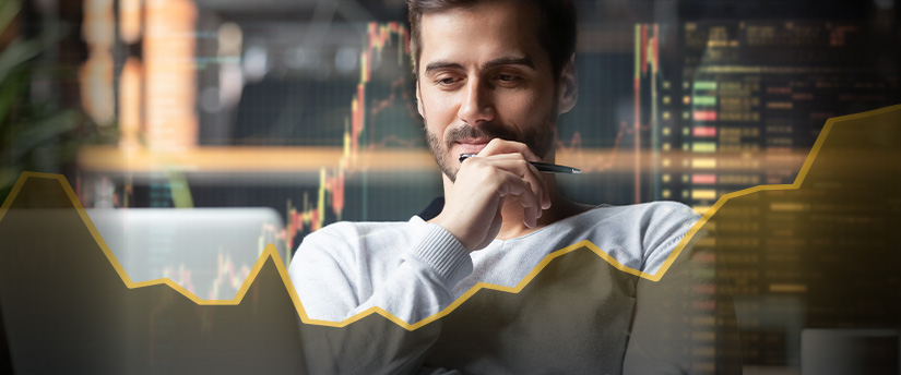 A trader analyzes market data on a computer screen to make informed CFD trading decisions.