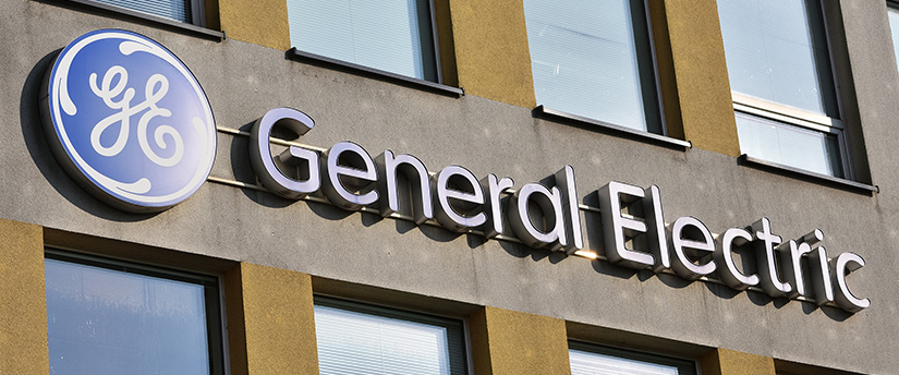 A large General Electric sign on the side of a building