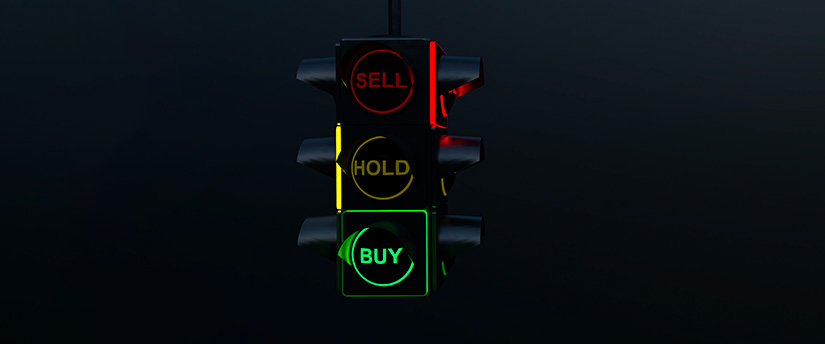 A traffic light with three signs: 'Sell,' 'Hold,' 'Buy,' symbolizing decision points in BTC CFD trading
