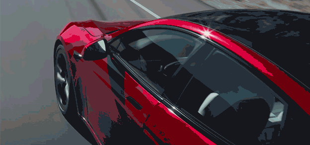 A striking red Tesla car smoothly gliding down the open road, showcasing its innovative design and performance.