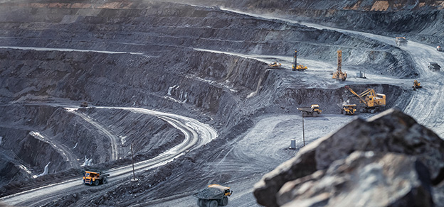 Bulldozers at work in a mining field, showcasing the industrial operations of Anglo American plc.