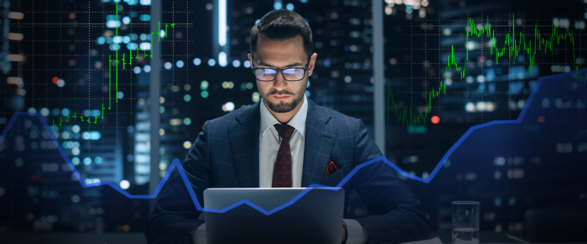 a man analyzing trading data on Metatrader 4 platform with laptop
