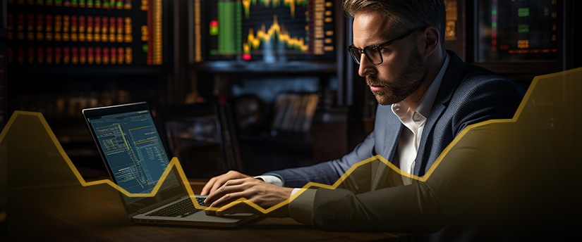 Un trader concentré analyse les graphiques forex et prend des décisions de trading.