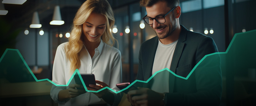 A trader and a woman attentively examine a graph on their mobile device, discussing trading strategies.
