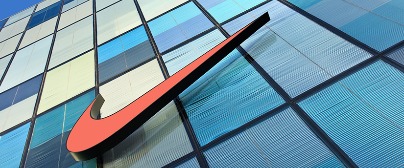 A red Nike sign displayed on a building, representing the iconic brand.