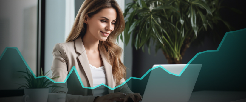 A woman at a desk with a laptop, analyzing an upward graph. She is engaged in forex trading in the market.