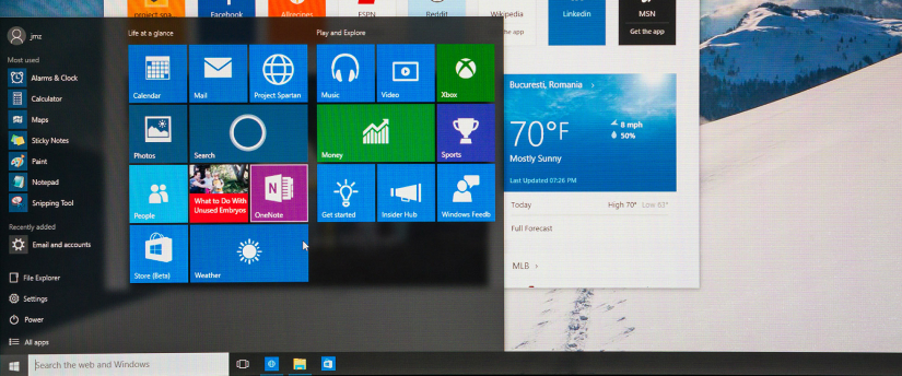 A picture of a Microsoft Windows PC with a logo on the screen.