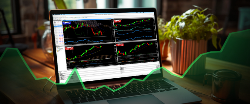 Laptop displaying forex trading on Metatrader 4 platform using momentum strategy.