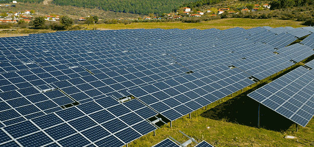 Solar panels on a hillside in the countryside, harnessing renewable energy from the sun.