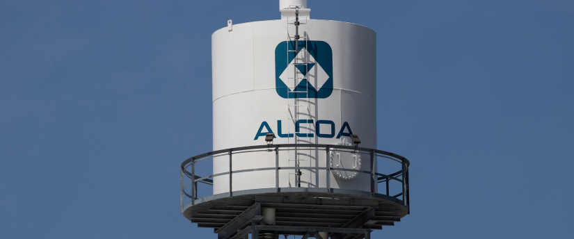 White and blue tower with "Alcoa" written on it