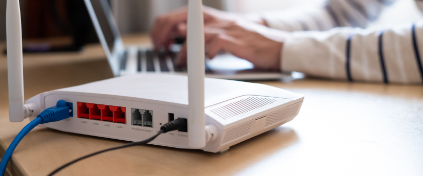 A person sitting at a laptop computer connected to an Equinix router network.