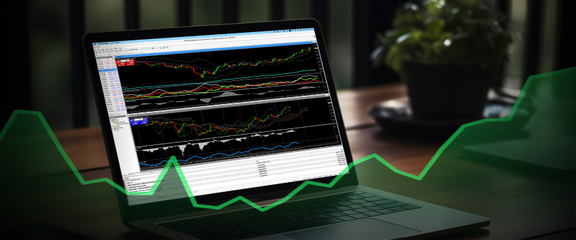 A laptop displaying a forex trading platform with charts and indicators, including the moving average indicator for MT4 analysis.