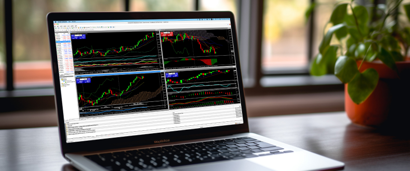 A laptop displaying multiple trading screens on its screen, used for learning forex trading on the MetaTrader platform