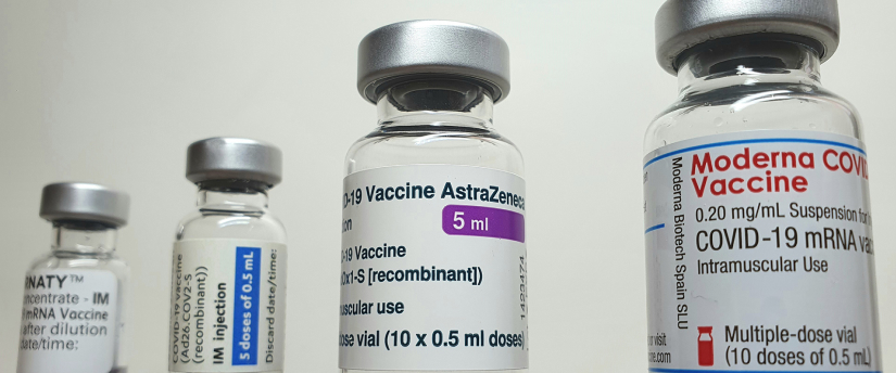 Vaccine vials of moderna vaccines neatly arranged on a shelf, ready for distribution