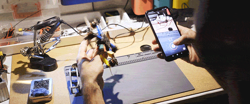 An individual with a mobile device, try to fix a product from Hornbach