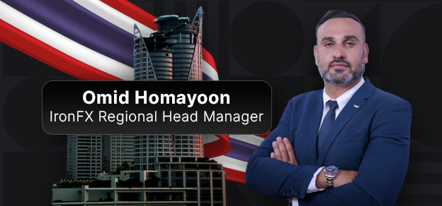 Omid Honawoon, Regional Head Manager, leading a team meeting in a modern office environment.