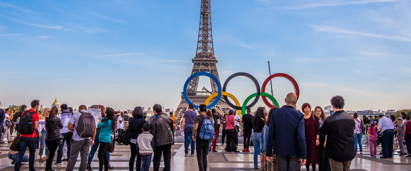 Olympic rings hanging in front of the Eiffel Tower in Paris.