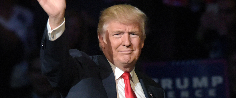 President Donald Trump waves to the crowd at a political rally.